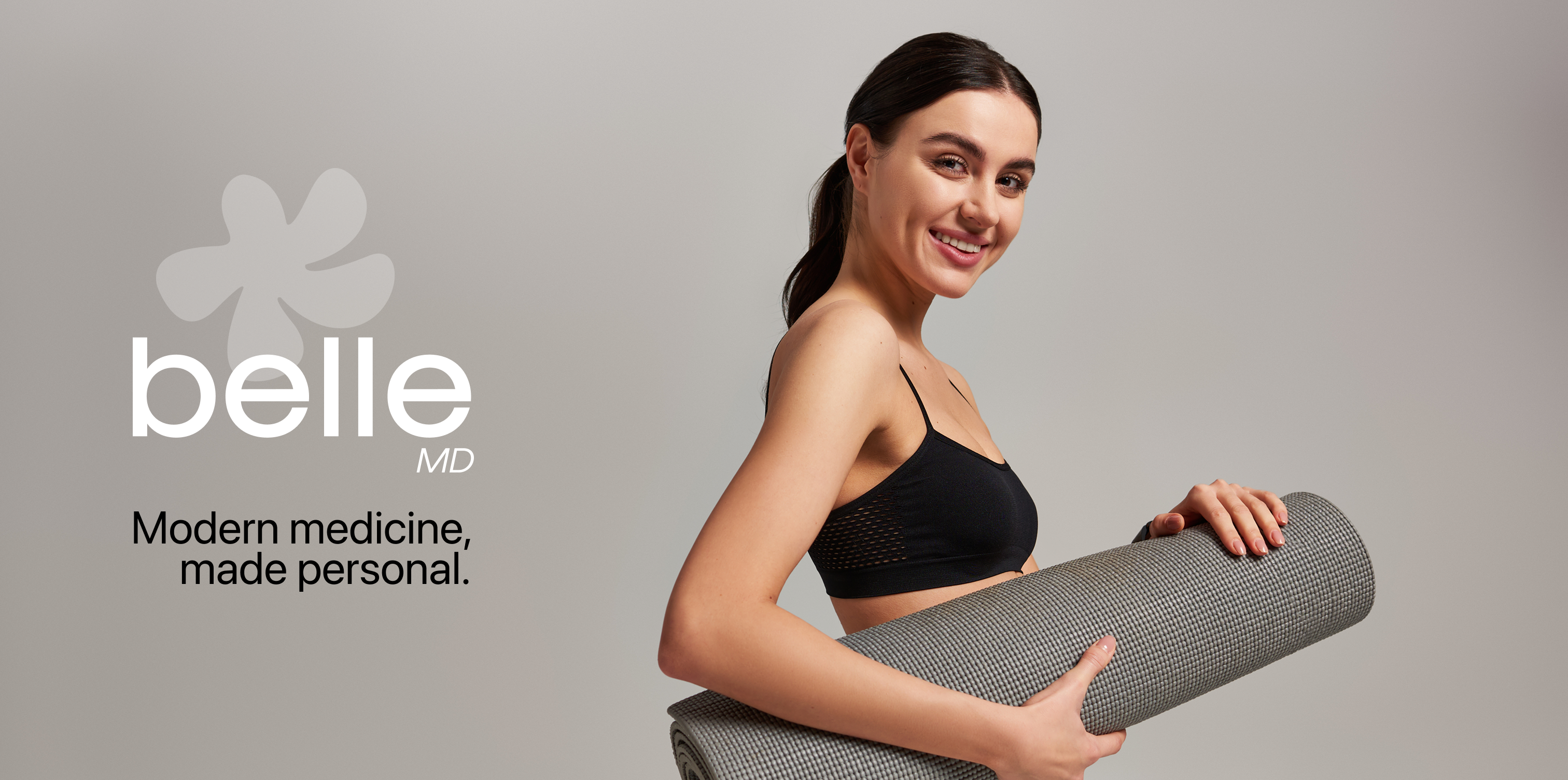 BelleMD logo and a smiling woman holding a yoga mat
